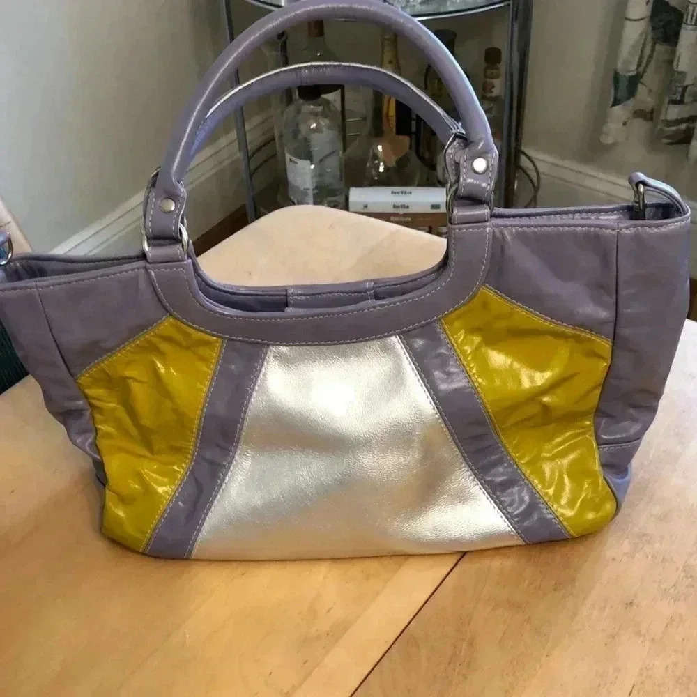 Kiki Pearl silver/La ended/chartreuse shoulder bag with magnetic close.